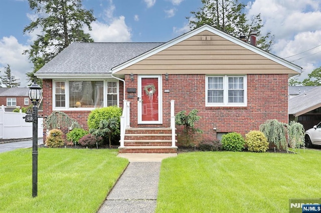 110 Harrison Ave, Hasbrouck Heights, NJ 07604 - bungalow featuring a front yard, brick siding, and a shingled roof