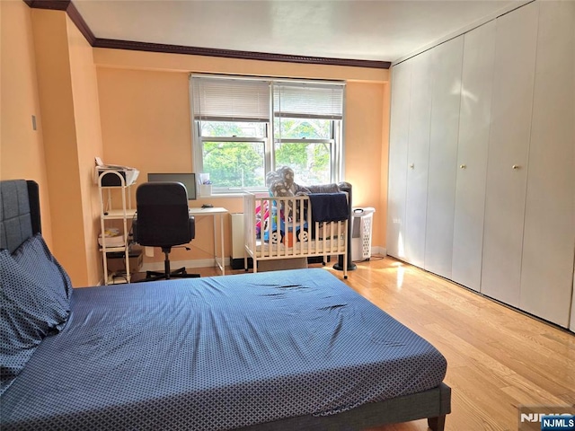 6600 Jfk Blvd E Unit 3J, West New York, NJ 07093 - bedroom with wood finished floors and crown molding