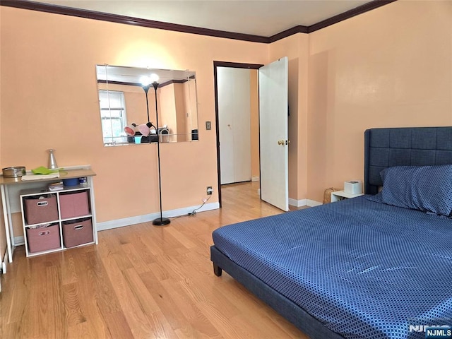 6600 Jfk Blvd E Unit 3J, West New York, NJ 07093 - bedroom featuring wood finished floors, ornamental molding, and baseboards