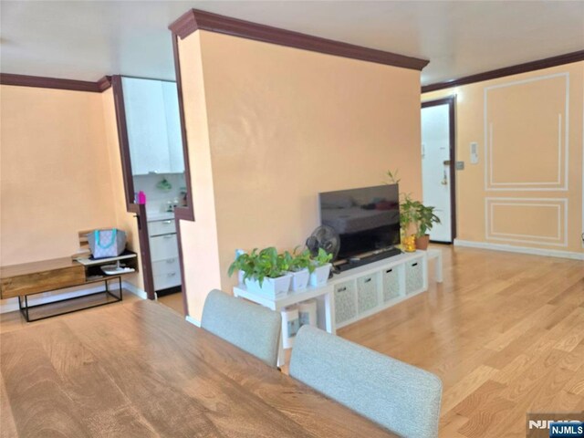 6600 Jfk Blvd E Unit 3J, West New York, NJ 07093 - living area featuring ornamental molding, wood finished floors, and baseboards