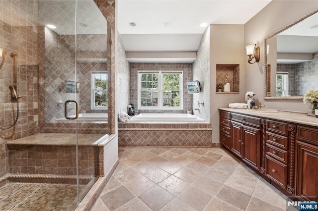 15 Fred St, Old Tappan, NJ 07675 - bathroom featuring vanity, a stall shower, stone tile floors, and a bath