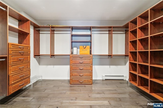15 Fred St, Old Tappan, NJ 07675 - walk in closet with a baseboard radiator and dark wood-style floors
