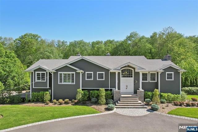 15 Fred St, Old Tappan, NJ 07675 - single story home featuring a front yard and a chimney