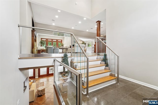 15 Fred St, Old Tappan, NJ 07675 - staircase with recessed lighting, decorative columns, tile patterned floors, and a high ceiling