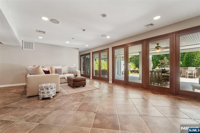 15 Fred St, Old Tappan, NJ 07675 - living room with plenty of natural light, french doors, recessed lighting, baseboards, and tile patterned floors