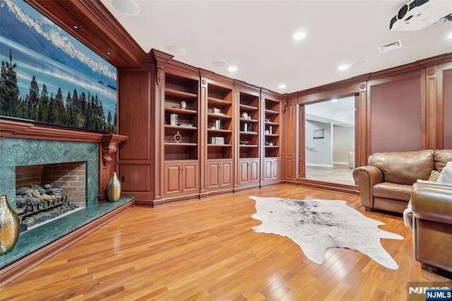 15 Fred St, Old Tappan, NJ 07675 - living room with light wood-style flooring, a fireplace, recessed lighting, crown molding, and baseboards