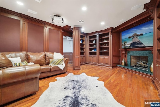 15 Fred St, Old Tappan, NJ 07675 - living area featuring light wood finished floors, a high end fireplace, recessed lighting, and ornamental molding