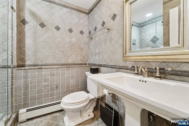 15 Fred St, Old Tappan, NJ 07675 - full bath featuring a baseboard radiator, tiled shower, toilet, and tile walls