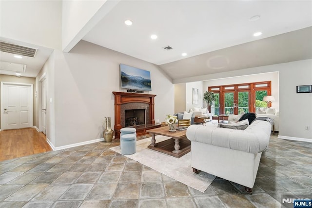 15 Fred St, Old Tappan, NJ 07675 - living room featuring baseboards, recessed lighting, stone finish flooring, a premium fireplace, and lofted ceiling