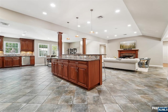 15 Fred St, Old Tappan, NJ 07675 - kitchen with stainless steel dishwasher, decorative columns, open floor plan, stone counters, and recessed lighting