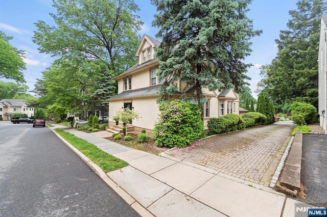 296 Highfield Ln, Nutley, NJ 07110 - view of side of property featuring stucco siding