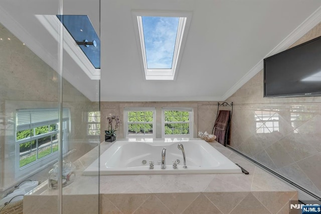 248 Camden St, Oradell, NJ 07649 - bathroom featuring a skylight, vaulted ceiling, a whirlpool tub, crown molding, and healthy amount of natural light