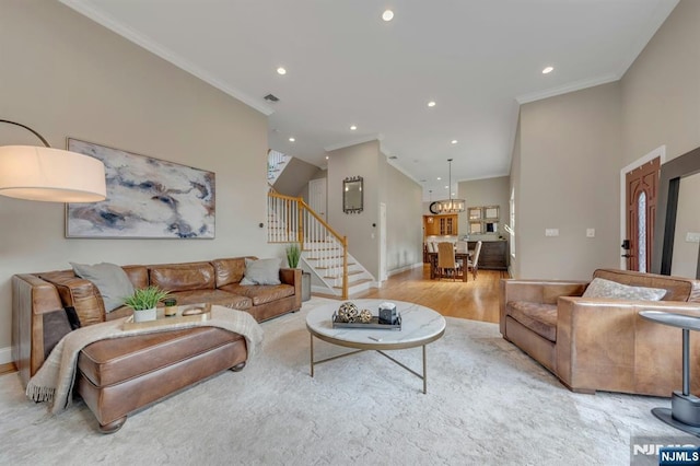 248 Camden St, Oradell, NJ 07649 - living room with stairway, recessed lighting, ornamental molding, light wood-type flooring, and baseboards