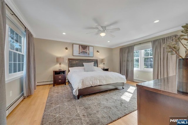 248 Camden St, Oradell, NJ 07649 - bedroom featuring a baseboard heating unit, light wood finished floors, ornamental molding, and recessed lighting