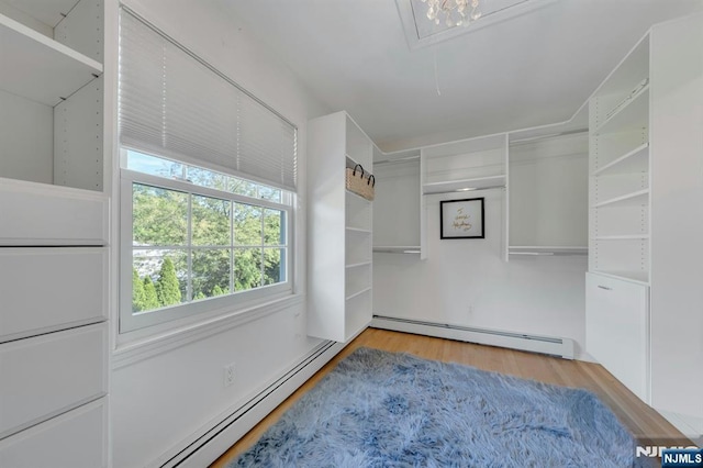 248 Camden St, Oradell, NJ 07649 - spacious closet featuring a baseboard heating unit, attic access, and wood finished floors