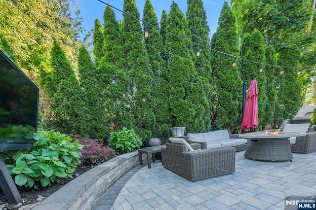 248 Camden St, Oradell, NJ 07649 - view of patio with an outdoor living space with a fire pit