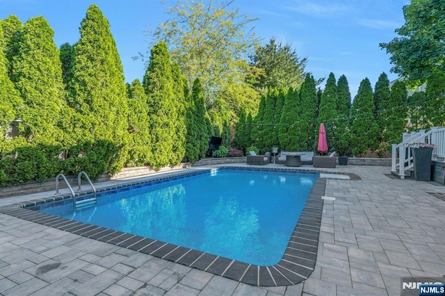 248 Camden St, Oradell, NJ 07649 - outdoor pool with a patio area and an outdoor living space