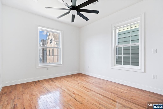 133 4th St, Bayonne, NJ 07002 - unfurnished room featuring light wood-style flooring, baseboards, and ceiling fan