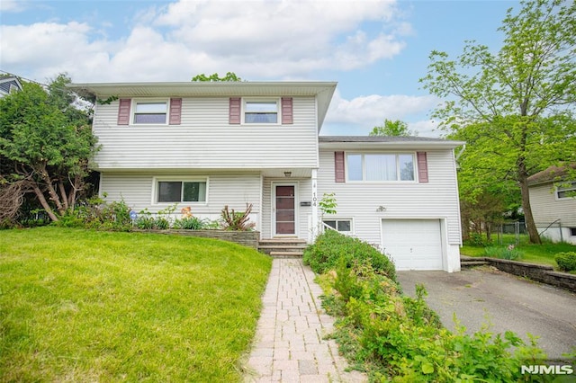104 Richard St, Rockaway Township, NJ 07801 - tri-level home featuring driveway, a garage, and a front yard