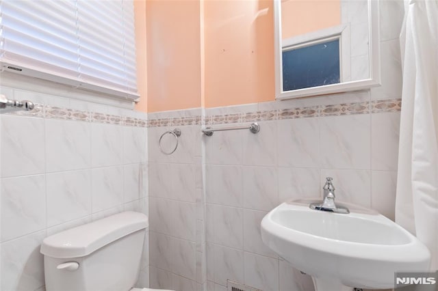 104 Richard St, Rockaway Township, NJ 07801 - bathroom featuring tile walls, toilet, and a sink
