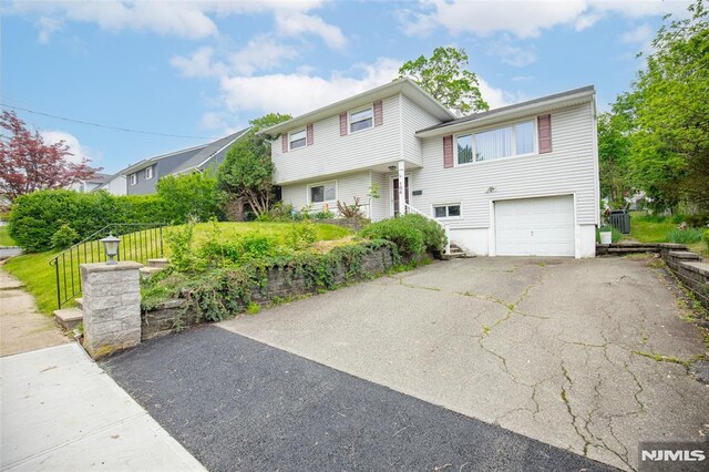 104 Richard St, Rockaway Township, NJ 07801 - view of front of home with an attached garage and asphalt driveway