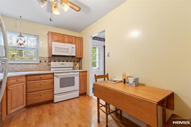 104 Richard St, Rockaway Township, NJ 07801 - kitchen featuring white appliances, light wood finished floors, a ceiling fan, light countertops, and a sink