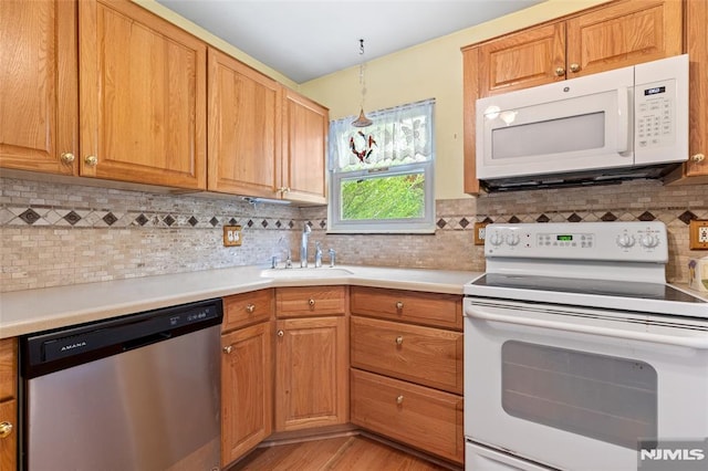 104 Richard St, Rockaway Township, NJ 07801 - kitchen featuring white appliances, a sink, light countertops, and tasteful backsplash