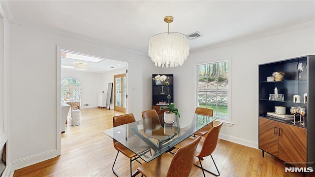 263 Standish Rd, Ridgewood, NJ 07450 - dining room with light wood finished floors, ornamental molding, a chandelier, and baseboards