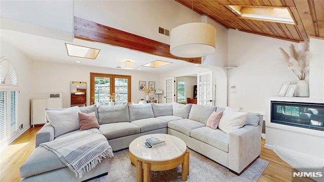 263 Standish Rd, Ridgewood, NJ 07450 - living area featuring a skylight, light wood-type flooring, french doors, wooden ceiling, and lofted ceiling