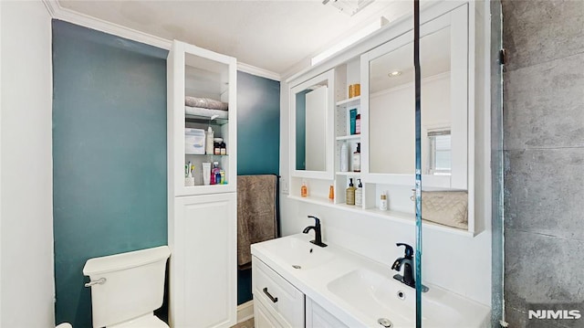 263 Standish Rd, Ridgewood, NJ 07450 - bathroom with toilet, double vanity, and ornamental molding