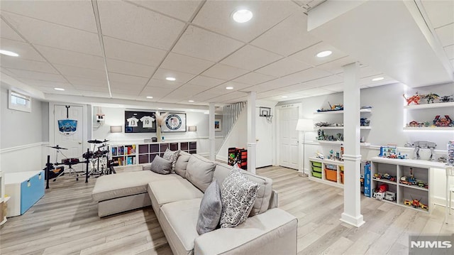 263 Standish Rd, Ridgewood, NJ 07450 - living room with light wood finished floors, recessed lighting, stairway, and a drop ceiling