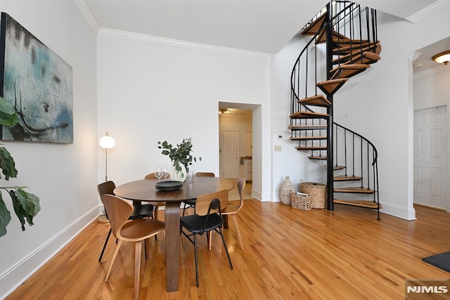167 Wayne St Unit 407, Jersey City, NJ 07302 - dining space with stairway, ornamental molding, light wood-type flooring, and baseboards