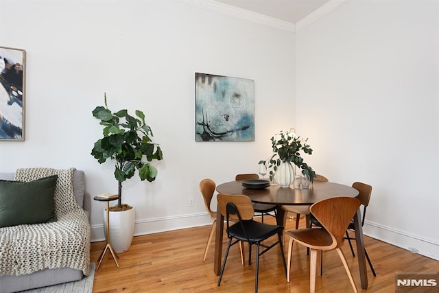 167 Wayne St Unit 407, Jersey City, NJ 07302 - dining area with crown molding, light wood-style floors, and baseboards