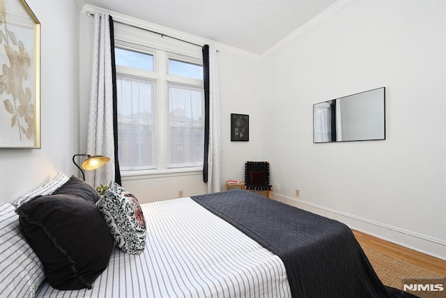 167 Wayne St Unit 407, Jersey City, NJ 07302 - bedroom featuring ornamental molding, wood finished floors, and baseboards