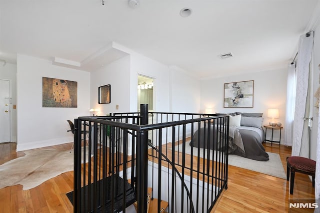 167 Wayne St Unit 407, Jersey City, NJ 07302 - corridor with an upstairs landing, wood finished floors, and baseboards