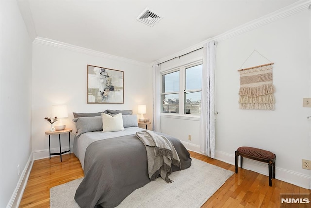 167 Wayne St Unit 407, Jersey City, NJ 07302 - bedroom with crown molding, light wood finished floors, and baseboards