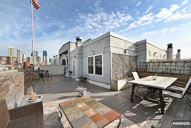167 Wayne St Unit 407, Jersey City, NJ 07302 - deck featuring outdoor dining area and a view of skyline