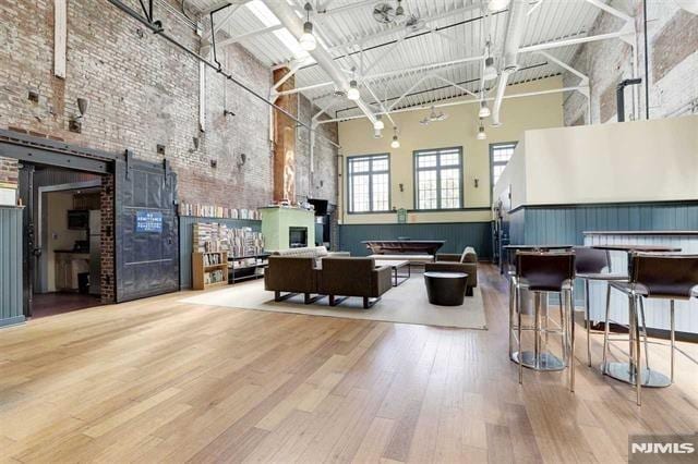 167 Wayne St Unit 407, Jersey City, NJ 07302 - building lobby with a high ceiling and brick wall