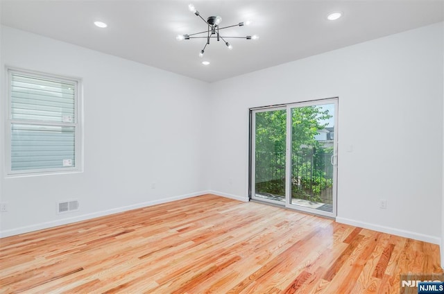 85 Myrtle Ave, Jersey City, NJ 07305 - unfurnished room with a chandelier, wood finished floors, baseboards, and recessed lighting