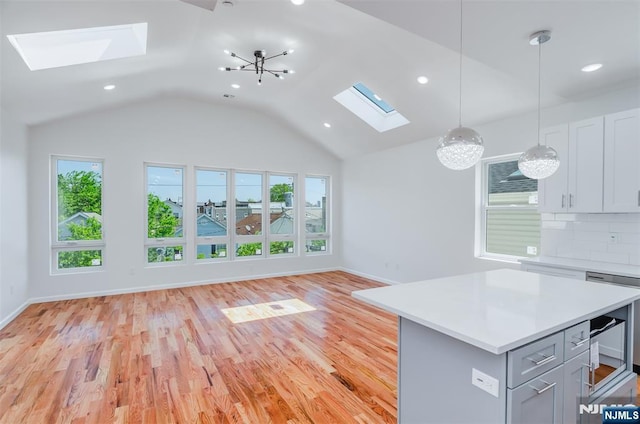 85 Myrtle Ave, Jersey City, NJ 07305 - kitchen with a skylight, light countertops, a chandelier, recessed lighting, and lofted ceiling