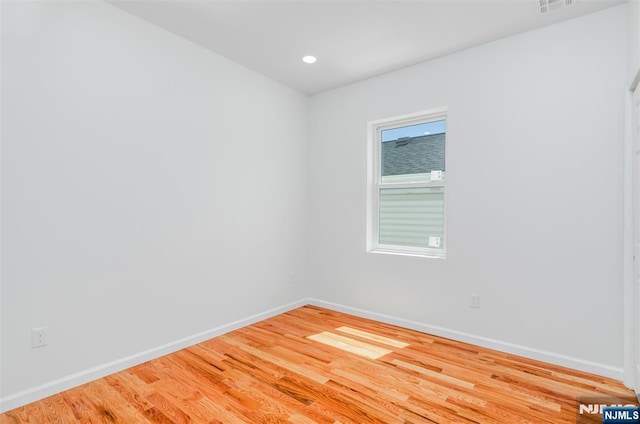 85 Myrtle Ave, Jersey City, NJ 07305 - unfurnished room featuring baseboards, light wood-type flooring, and recessed lighting