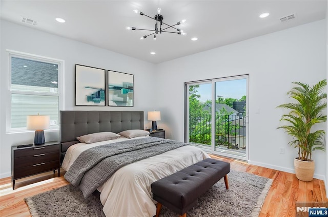 85 Myrtle Ave, Jersey City, NJ 07305 - bedroom featuring access to exterior, a chandelier, wood finished floors, recessed lighting, and baseboards