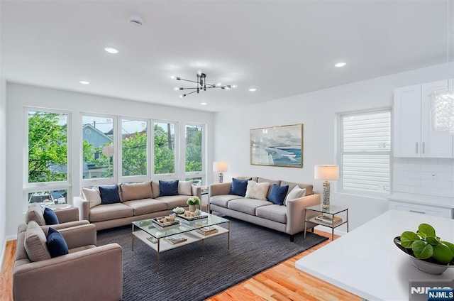 85 Myrtle Ave, Jersey City, NJ 07305 - living room featuring light wood finished floors, recessed lighting, and a chandelier