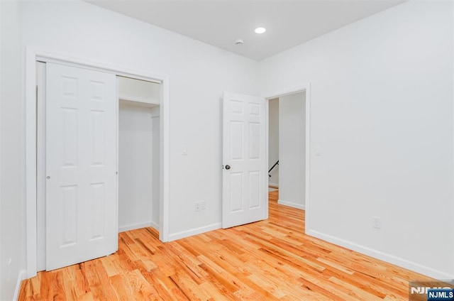 85 Myrtle Ave, Jersey City, NJ 07305 - unfurnished bedroom with light wood-type flooring, baseboards, a closet, and recessed lighting