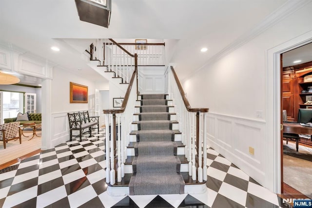 76 Wildwood Rd, Ridgewood, NJ 07450 - stairs featuring tile patterned floors, recessed lighting, ornamental molding, a decorative wall, and a wainscoted wall