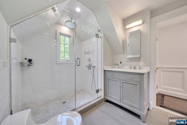 76 Wildwood Rd, Ridgewood, NJ 07450 - full bath featuring a shower stall, vanity, tile patterned flooring, and vaulted ceiling
