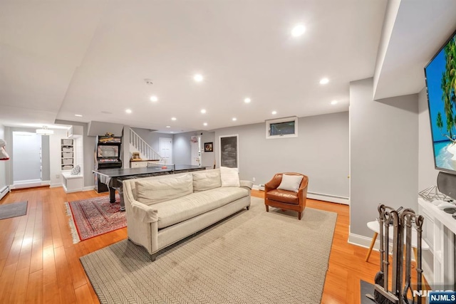 76 Wildwood Rd, Ridgewood, NJ 07450 - living area with baseboard heating, stairway, baseboards, light wood-type flooring, and recessed lighting