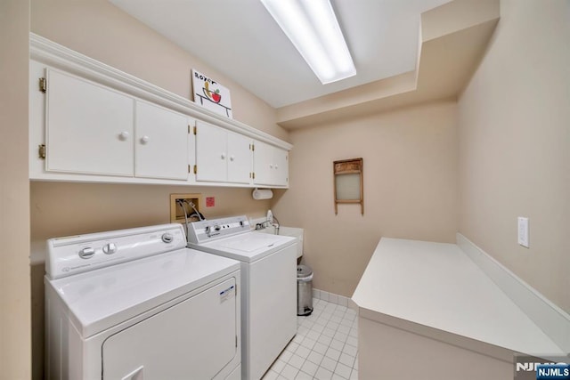 76 Wildwood Rd, Ridgewood, NJ 07450 - laundry area with cabinet space, washing machine and dryer, and light tile patterned floors