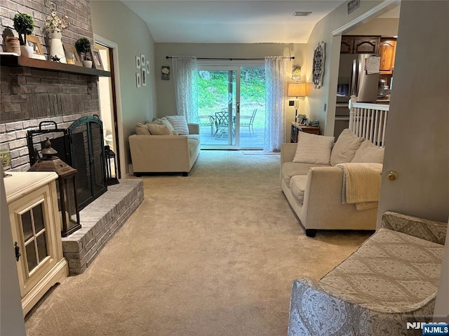 32 Northgate, Wanaque, NJ 07465 - living room featuring light colored carpet, a fireplace, and lofted ceiling