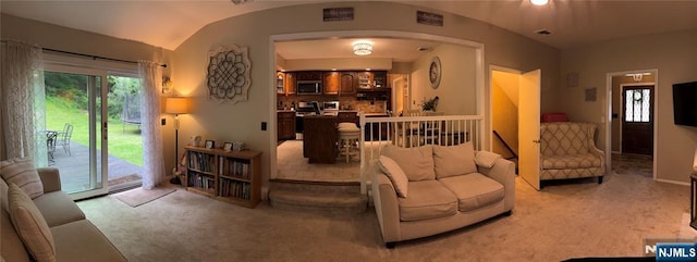 32 Northgate, Wanaque, NJ 07465 - living area featuring carpet flooring, arched walkways, and lofted ceiling